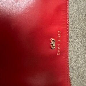 Worn and loved used condition Cole Hann. Red crossbody bag.